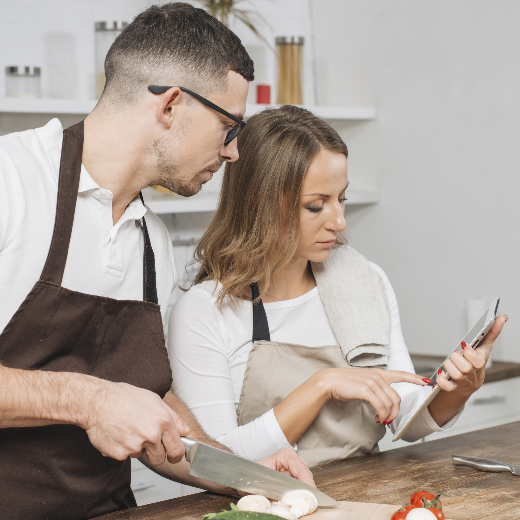 Instructor guiding student in the kitchen